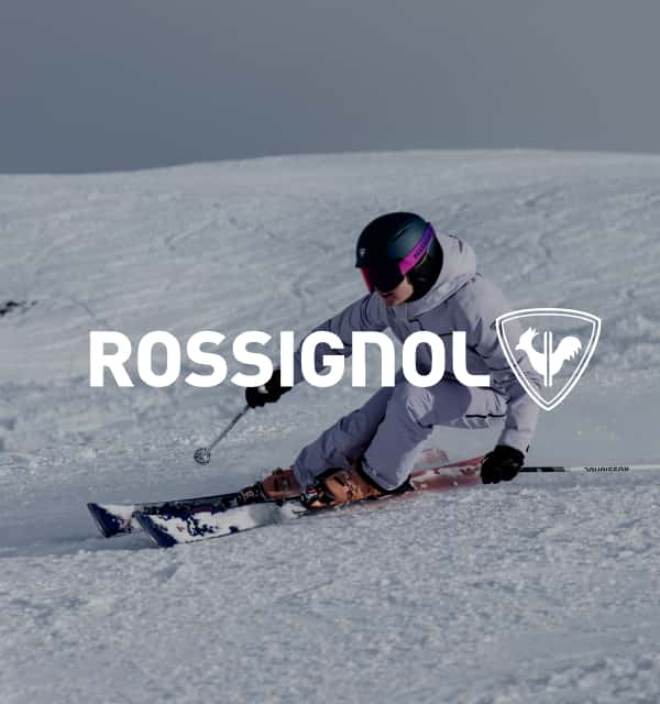 Person auf einer Skipiste und Rossignol Logo